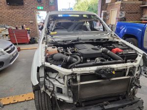 Ford Ranger XLT White Smash repair dents PDR Dah Cheong Sydney work in progress paint