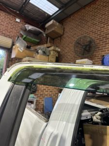 Ford Ranger XLT White Smash repair dents PDR Dah Cheong Sydney work in progress paint