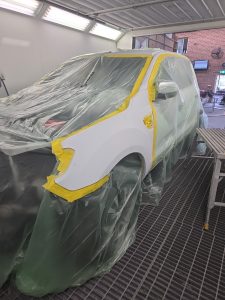 Ford Ranger XLT White Smash repair dents PDR Dah Cheong Sydney work in progress paint