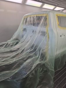 Ford Ranger XLT White Smash repair dents PDR Dah Cheong Sydney work in progress paint