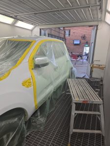 Ford Ranger XLT White Smash repair dents PDR Dah Cheong Sydney work in progress paint