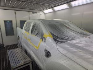 Ford Ranger XLT White Smash repair dents PDR Dah Cheong Sydney work in progress paint